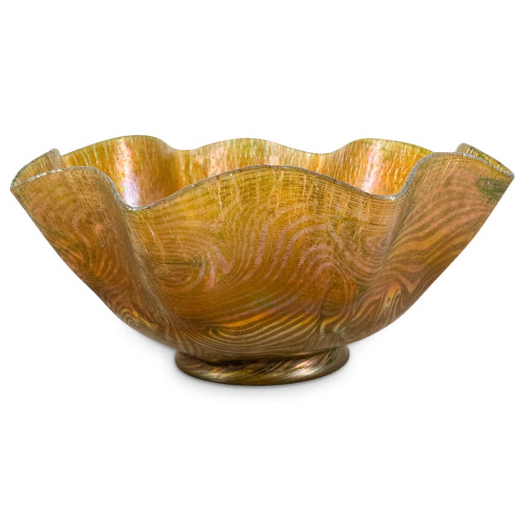 Tiffany Studios Favrile Glass Shade: DESCRIPTION: Tiffany Studios Favrile glass shade with ruffled rim and bronze fitting. Bronze impressed: "Tiffany Studios" Signed: "L.C.T" at socket side of shade. CIRCA: Early 20th Cent. ORIGIN: USA D