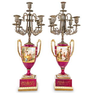 (2 Pc) Antique Royal Vienna Porcelain & Bronze Candelabras: DESCRIPTION: (2 Pc) Pair of antique Royal Vienna porcelain and bronze candelabras. Each vase is finely painted with figurative classical scenes to the front on a rich magenta ground with gilt foliate