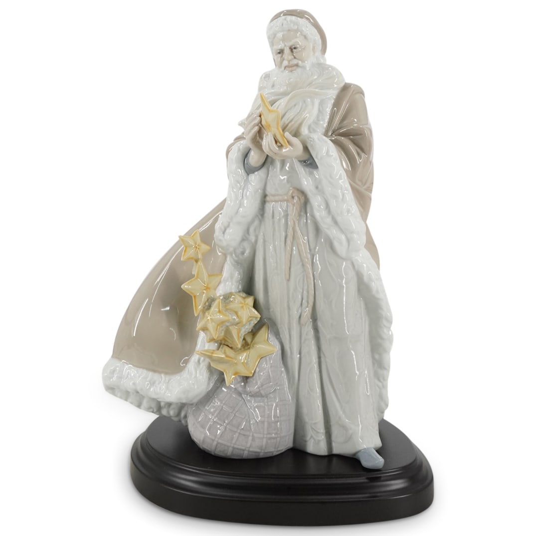 Lladro Limited Edition "Father Christmas" Glazed Porcelain Figurine: DESCRIPTION: Lladro porcelain figurine titled "Father Christmas" designed by sculptor Juan Carlos Ferri Herrero. The piece has a glazed finish. Model number: #1911. Year Issued: 2005. Year Retired: 20