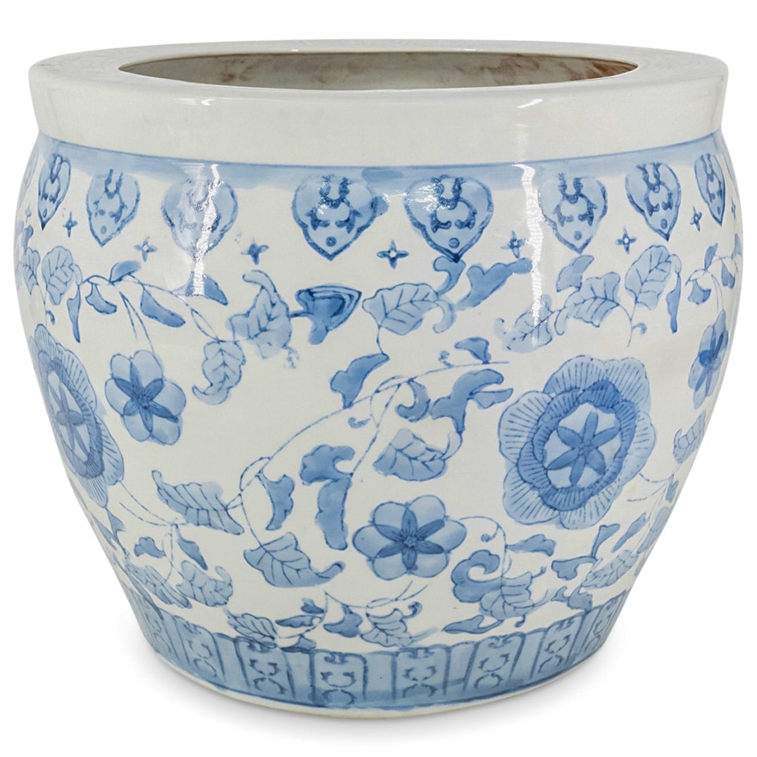 Vintage Chinese Blue And White Porcelain Planter: DESCRIPTION: Vintage blue and white porcelain planter featuring floral and foliage motifs against a white background and lingzhi patterns just under the lip. CIRCA: 20th Century ORIGIN: China DIMENSIO