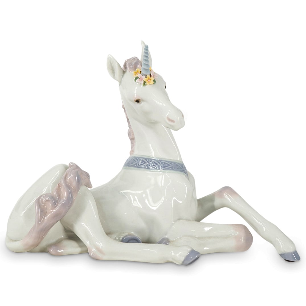 Lladro "Little Unicorn" Glazed Porcelain Figurine: DESCRIPTION: Lladro glazed porcelain figurine titled "Little Unicorn". Depicts a resting unicorn. Model number: #5826. Made in Spain by sculptor Jose Luis Alvarez. Issued in 1991 and Retired in 1997. 