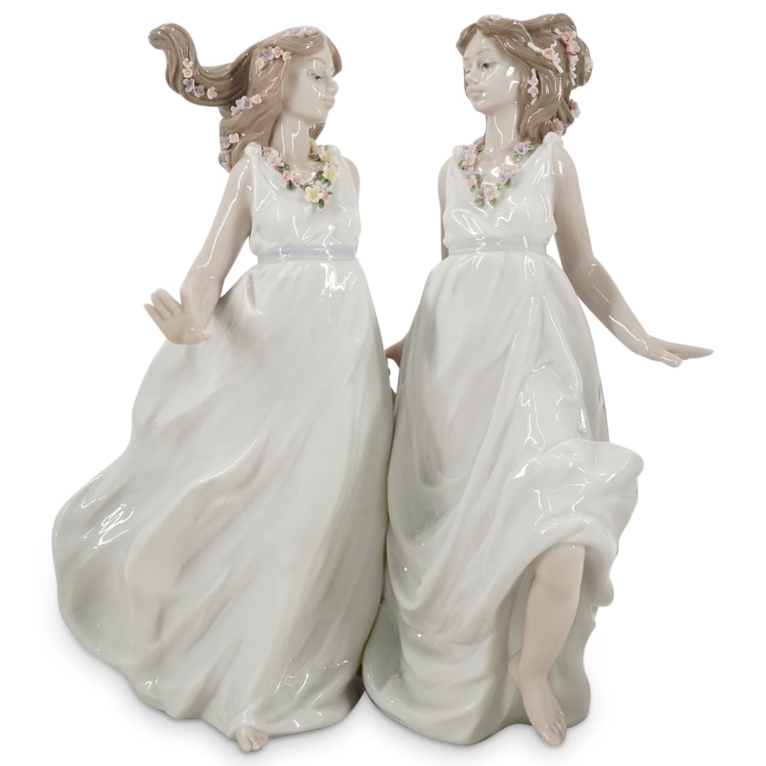 Lladro "Allegory Of Spring" Glazed Porcelain Figurine: DESCRIPTION: Lladro porcelain group figurine titled "Allegory Of Spring" designed by sculptor Antonio Ramos. The piece has a glazed finish. Model number: #6241. Year Issued: 1995. Year Retired: 2000. 