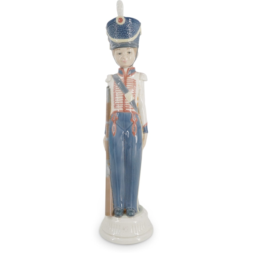 Lladro "At Attention" Glazed Porcelain Figurine: DESCRIPTION: Lladro porcelain figurine titled "At Attention" designed by sculptor Vincente Martinez. The piece has a glazed finish. Model number: #5407. Year Issued: 1987. Year Retired: 1989. Stamped 