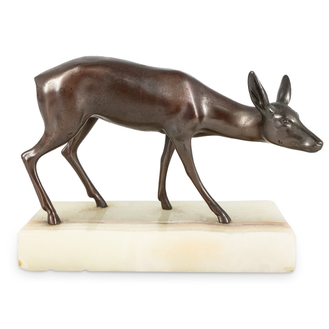 Bronze Deer Mounted to Onyx Base: DESCRIPTION: A Bronze deer finished in a dark brown patina and fitted atop an onyx base. CIRCA: Mid-Late 20th Cent. ORIGIN: Continental DIMENSIONS: H: 4.5" W: 6" CONDITION: Great Condition.