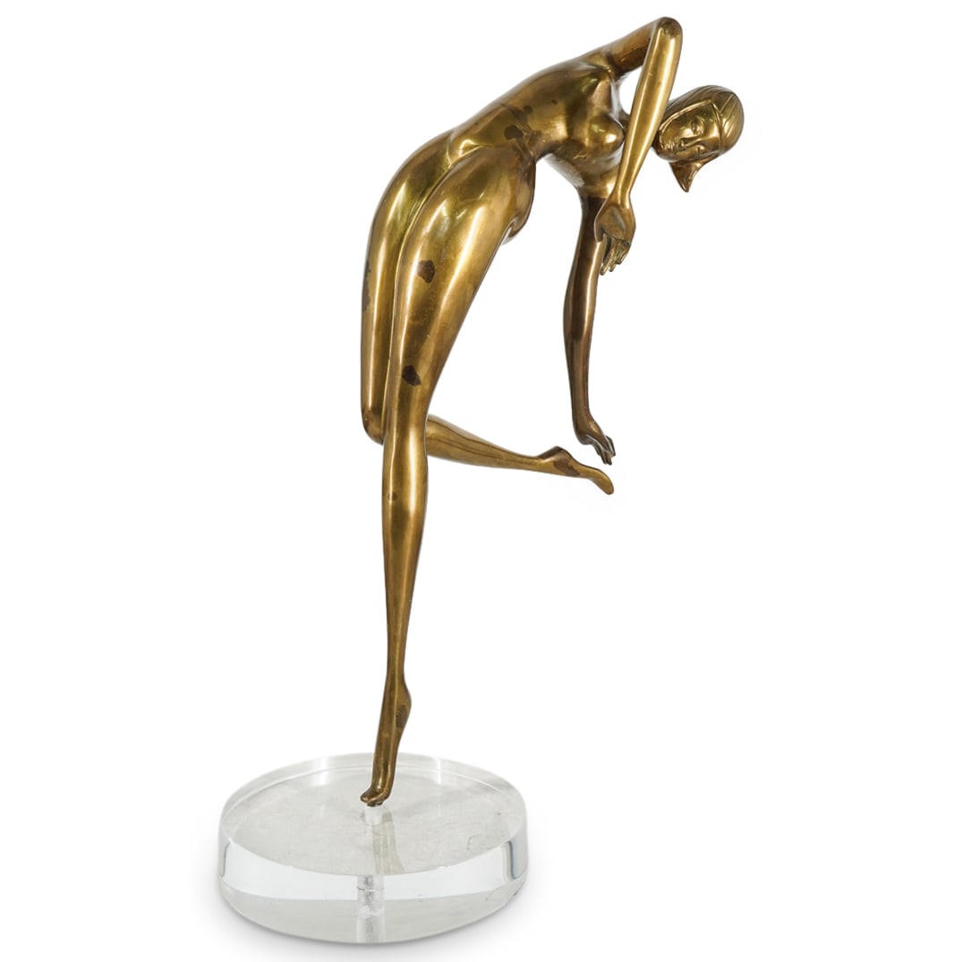Retro Modernist Brass and Lucite Nude Dancer: DESCRIPTION: A retro brass figure depicts a nude oriental dancer fitted atop a circular lucite base. CIRCA: 1980s ORIGIN: USA DIMENSIONS: H:23.5" W: 14" CONDITION: Good condition. minor abrasions
