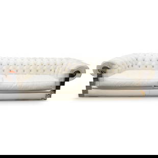 Fendi Designer Chesterfield Leather Couch: DESCRIPTION: Fendi couch fashioned in the Chesterfield design and adorned throughout the back with logo emblazoned buttons. Finished with silver tone supports, the right of which is emblazoned "FENDI"