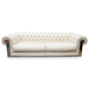 Fendi Designer Chesterfield Leather Couch: DESCRIPTION: Fendi couch fashioned in the Chesterfield design and adorned throughout the back with logo emblazoned buttons. Finished with silver tone supports, the right of which is emblazoned