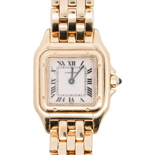 Cartier 18k Gold Ladies Tank Watch: DESCRIPTION: A Cartier ladies tank watch features a quartz movement, white dial, blue sapphire hands with black Roman numeral markers, affixed with a faux cabochon crown. Attached to a panthere 18k