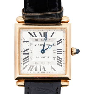 Cartier Tank Obus 18k Gold Watch: DESCRIPTION: A Cartier 18k gold "Obus" Mechanique 2380 Tank watch features manual winding, guilloche dial with roman numerals and the traditional Cartier blue sword hands with their signature blue