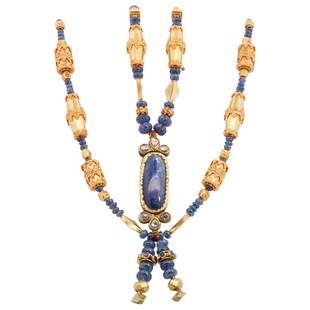 Mughal Style 18k Gold, Sapphire and Diamond Necklace: DESCRIPTION: A Mughal style 18k gold necklace comprised of oblong filigree beads alternating with gourd shaped Sapphires leading to a floral enamel decorated center pendant. The pendant fitted with