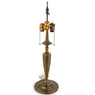 Antique Tiffany Studios Gilt Bronze Table Lamp: DESCRIPTION: Antique Tiffany Studios bronze three-light electric table lamp featuring octagonal stem and adjustable finial. Completed with mottled gilt accents. Marked with "Tiffany Studios New York