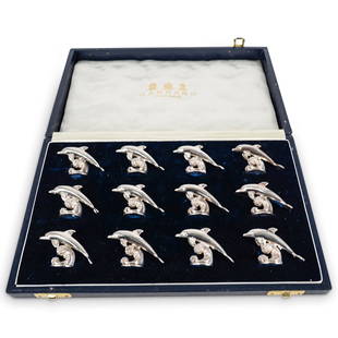 (12 Pc) Vintage 1995 English Sterling Silver Dolphin Place Card Holders: DESCRIPTION: (12 Pc) Vintage 1995 English sterling silver novelty place card holders, by Garrard & Co, London. Each of the models are cast in the form of a dolphin leaping over a wave. This set of twe