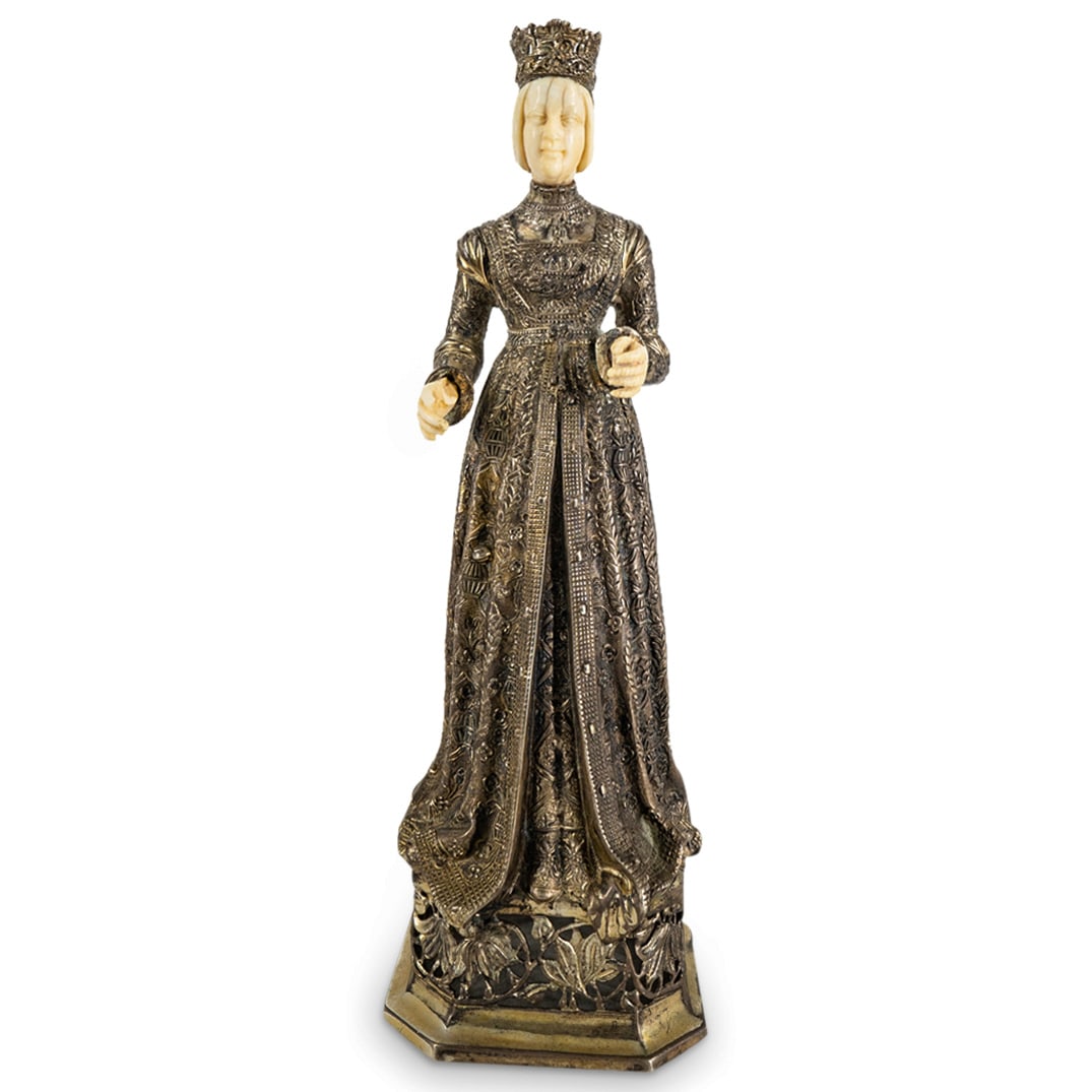 Antique German 800 Silver And Bone Noblewoman: DESCRIPTION: Sculpture of a noblewoman crafted from bone for head and hands and from 800 silver for crown, gown, and base. Decorated on dress with textured floral and foliage designs and finished on b