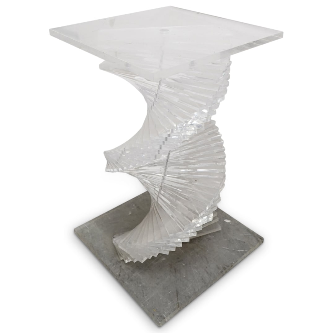 Mid Century Modern Lucite Staircase Pedestal: DESCRIPTION: Square lucite pedestal featuring a stem composed of stacked, spiraling slats resulting in a staircase aesthetic. CIRCA: Mid-20th Century ORIGIN: Continental DIMENSIONS: H: 28.75" W: 18" L