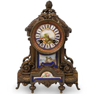 19th Cent. Japy Freres Porcelain and Bronze Gilt Clock: DESCRIPTION: 19th Cent. French Gilt Bronze Clock features with a painted porcelain dial, painted panel of a castle in landscape surrounded by a light blue border. Stamped on movement: "Japy Freres & C