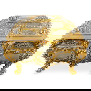 Antique French Mixed Metal Jewelry Box: DESCRIPTION: Antique mixed metal jewelry box featuring raised putto, pomegranate, and foliage designs decorated with gilt accenting and housing a velvet lined interior. CIRCA: 20th Century ORIGIN: Fra