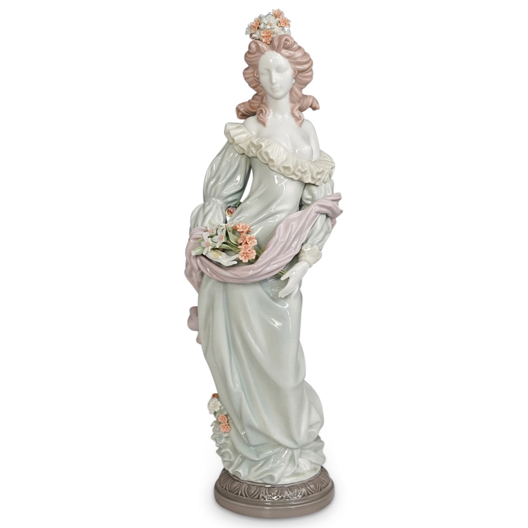 Lladro "Classic Fall" Porcelain Figurine: DESCRIPTION: Lladro porcelain figurine titled "Classic Fall" designed by Salvador Furio. Figure features of a young lady holding a bouquet of flowers. Edition number 1466 and retired in 1995. Traditio