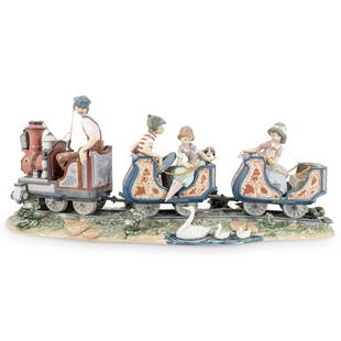 Lladro "Circus Train" Porcelain Grouping: DESCRIPTION: Lladro porcelain grouping entitled "Circus Train" ("Train of Joy"/ "Tren de Alegria") designed by Antonio Ramos depicting a man, a boy, two girls, and a dog riding in an amusement ride tr