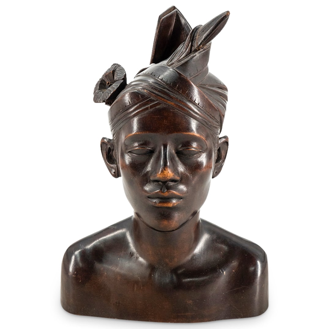 Antique Balinese Carved Wood Turbaned Man: DESCRIPTION: Carved wood sculpture depicting a groom wearing a wedding turban. CIRCA: 20th Century ORIGIN: Indonesia DIMENSIONS: H: 12.5" W: 5.75" L: 8.75" CONDITION: Repair evident on front tip of tu