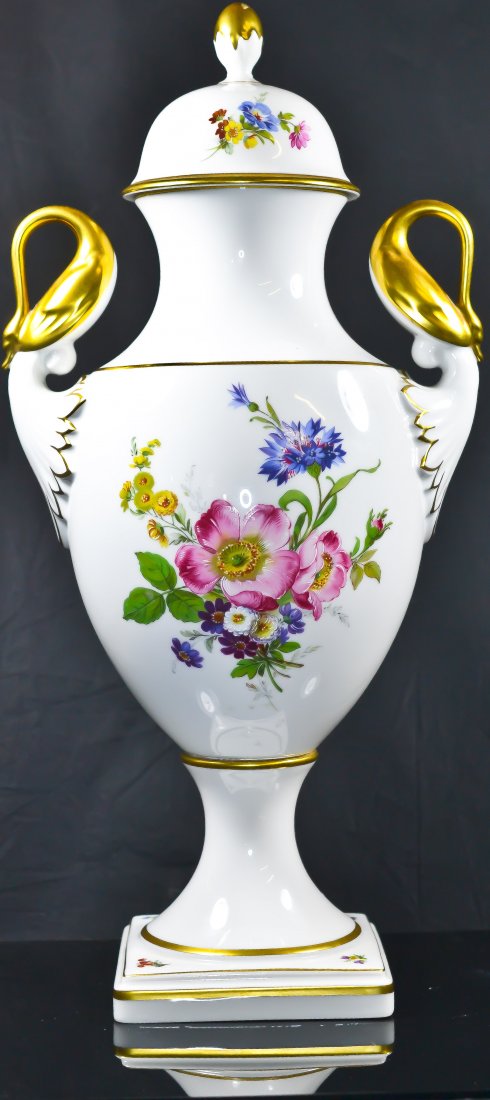 Art nouveau Kaiser floral porcelain urn: DESCRIPTION: Art nouveau Kaiser floral porcelain urn with a gold overlay swans as handles. Hallmarked Kaiser Germany underneath. CIRCA: 1900s MADE IN: Germany DIMENSIONS: H:16.5" L:8"