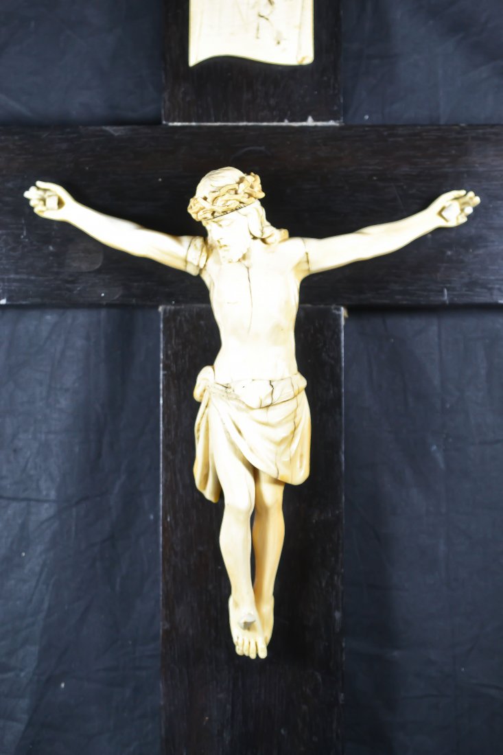 Antique carved ivory of Jesus Christ, wood cross: DESCRIPTION: Antique hand carved ivory of Jesus Christ on wood cross. Right arm has had small repair. Missing a couple of fingers. Immaculate detail CIRCA: 19/20th ct MADE IN: France DIMENSIONS: H:17.