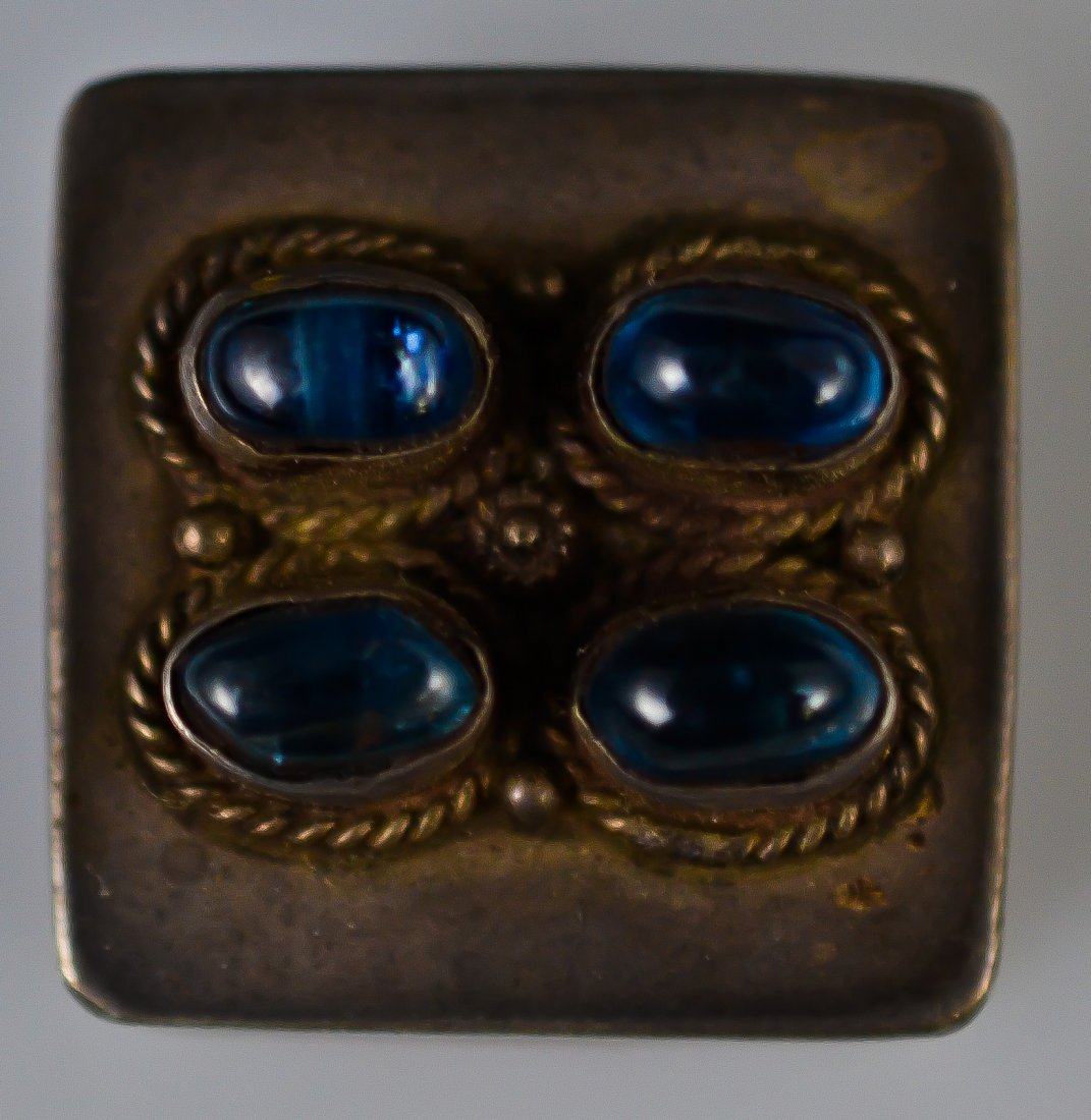 Antique sterling silver mini box with stones: DESCRIPTION: Antique baroque sterling silver mini box with stones. Hallmarked at the bottom 925. Weighs 14 grams CIRCA: 19th ct MADE IN: USA DIMENSIONS: H:0.5" 1"x 1"