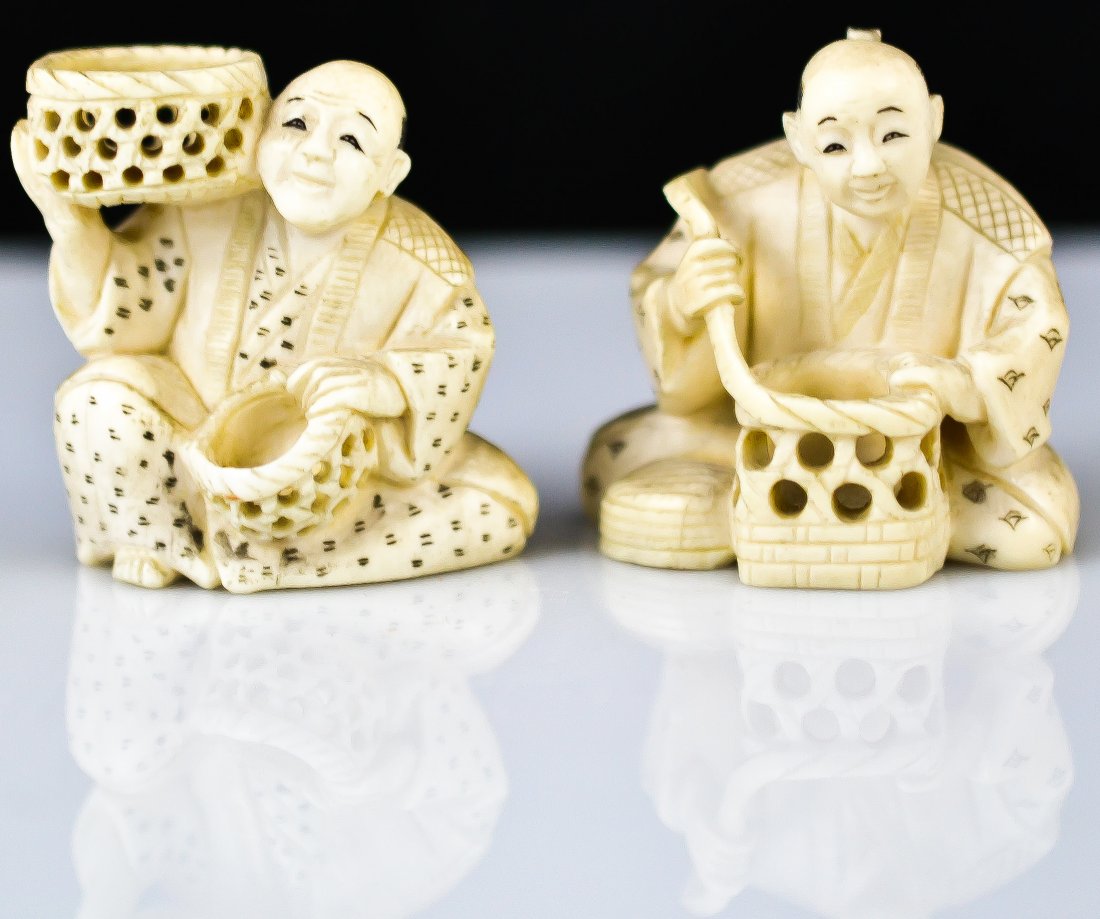Antique pair of Japanese ivory netsukes. Signed: DESCRIPTION: Antique pair of Japanese hand carved ivory netsukes of 2 men holding baskets. Both signed on the bottom. CIRCA: 19/20th ct MADE IN: Japan DIMENSIONS: H:1.75" each