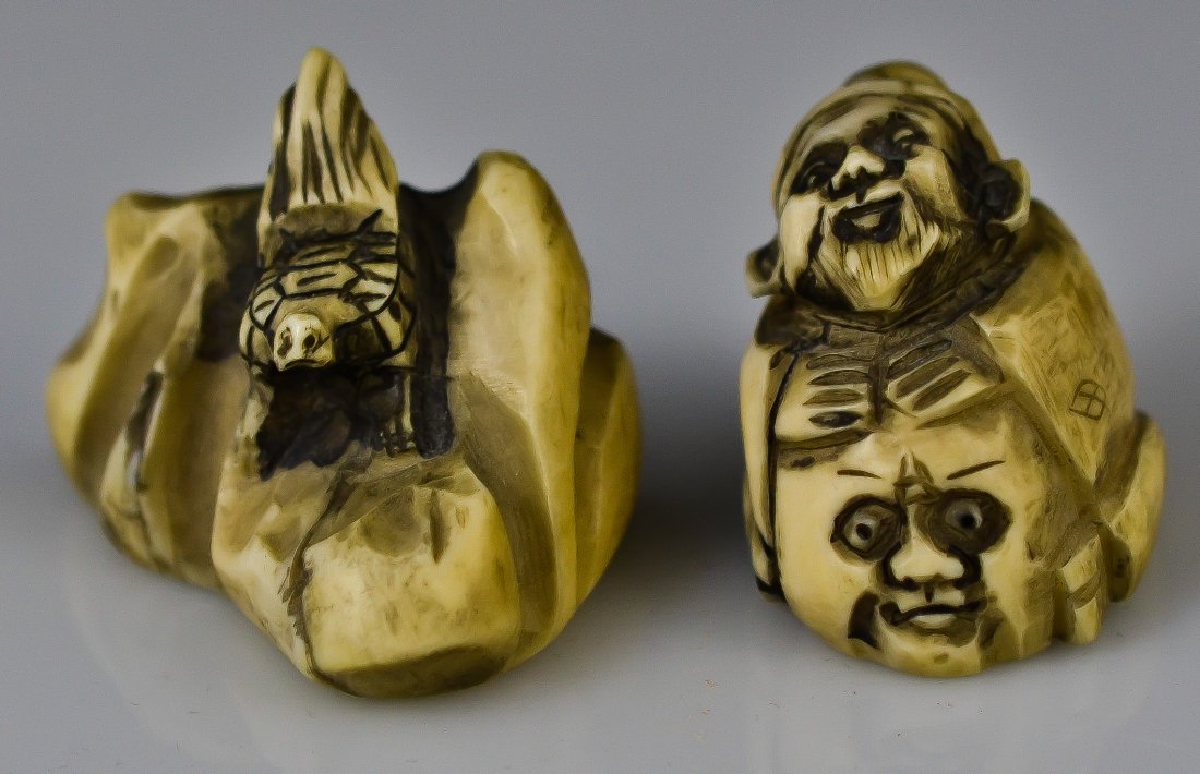 Antique pair of Japanese ivory netsukes. Signed: DESCRIPTION: Antique pair of Japanese hand carved ivory netsukes. Both with same signature. CIRCA: 19/20th ct MADE IN: Japan DIMENSIONS: H:1.5"