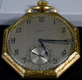 Vintage gold filled pocket watch by Elgin: DESCRIPTION: Gold filled Elgin pocket watch in perfect working condition. Hallmarked on the inside. CIRCA: 1920s MADE IN: USA DIMENSIONS: H:2.5" L:2"