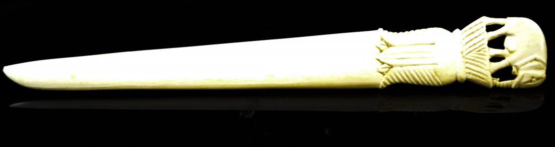 Large hand carved ivory elephant letter opener: DESCRIPTION: Oversized carved ivory letter opener. An elephant sits on top of an intricate base. Great detail CIRCA: 1940's-1960's MADE IN: India DIMENSIONS: H: 10.50" L: 1.40"