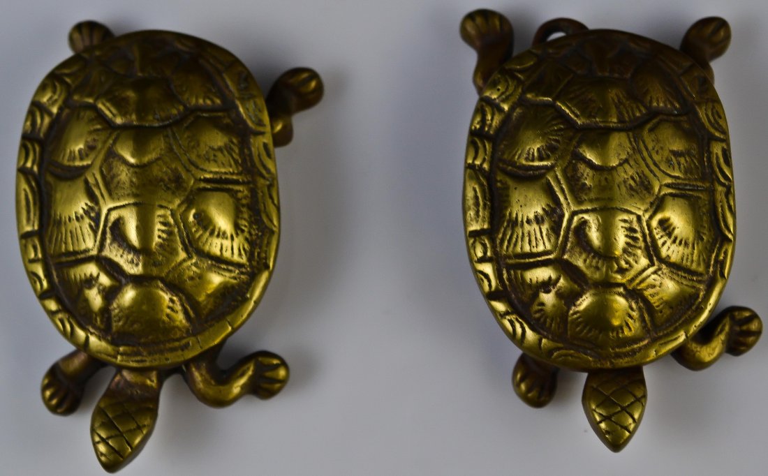 Pair of bronze turtle boxes. Signed: DESCRIPTION: Pair of English turtle bronze boxes. Opens up at the shell. Marked England on the bottom. CIRCA: 1930's-1950's MADE IN: England DIMENSIONS: H:4" L 2.50"