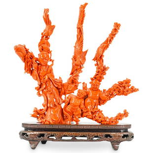 Large Fine Chinese Carved Red Coral Figural Group: DESCRIPTION: Antique large Chinese carved red coral sculpture featuring the depiction of Guanyin with fenghuang and sparrows above surrounded by cherry blossom flowers and two playful figures below. D