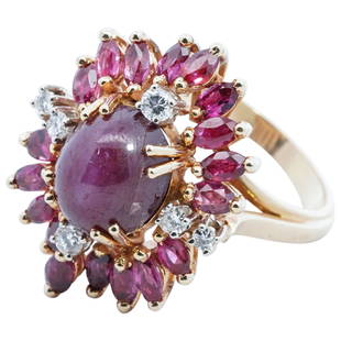 18k Gold, Star Sapphire and Diamond Cocktail Ring: DESCRIPTION: An elegant 18k yellow gold ring centered by a 2ct star ruby, encompassed by a series of marquee cut rubies and round cut diamonds. Marked "WS" "18k". Total weight: 9.5 grams (6.1 dwt) 