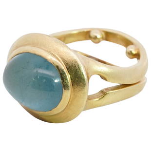 Mid Century 18k Gold and Aquamarine Ring: DESCRIPTION: A mid century 18k yellow gold ring features a split double band form, centered by a 3ct aquamarine cabochon. Incised along the inner band "MCD" "18k". Total weight: 13.2 grams (8.5 dwt) 