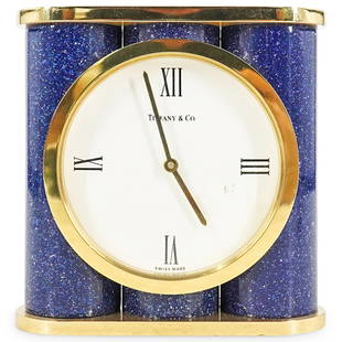 Tiffany & Co. Brass Enameled Desk Clock: DESCRIPTION: Tiffany & Co. brass desk clock with lapis lazuli looking enameled finish. Dial with white face and black Roman numerals. Marked: "Swiss Made" Quartz movement, serial: "215875" CIRCA: 20th