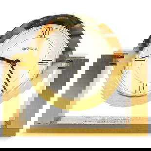 Tiffany & Co. Desk Clock: DESCRIPTION: Tiffany & Co. desk clock with gold tone and white dial. Signed at dial: "Tiffany & Co. Swiss Made" engraved inscription from: "Morgan Stanley & Co." with quartz battery movement. CIRCA: 1