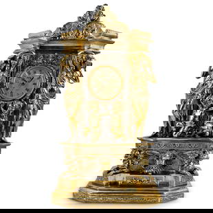 Crosa Gilt Mantel Clock: DESCRIPTION: Gilt mantel clock featuring Crosa battery-powered clock, putti, neoclassical figures, putto head, two winged beasts, floral and foliage motifs and Crosa battery-powered clock. Tested and