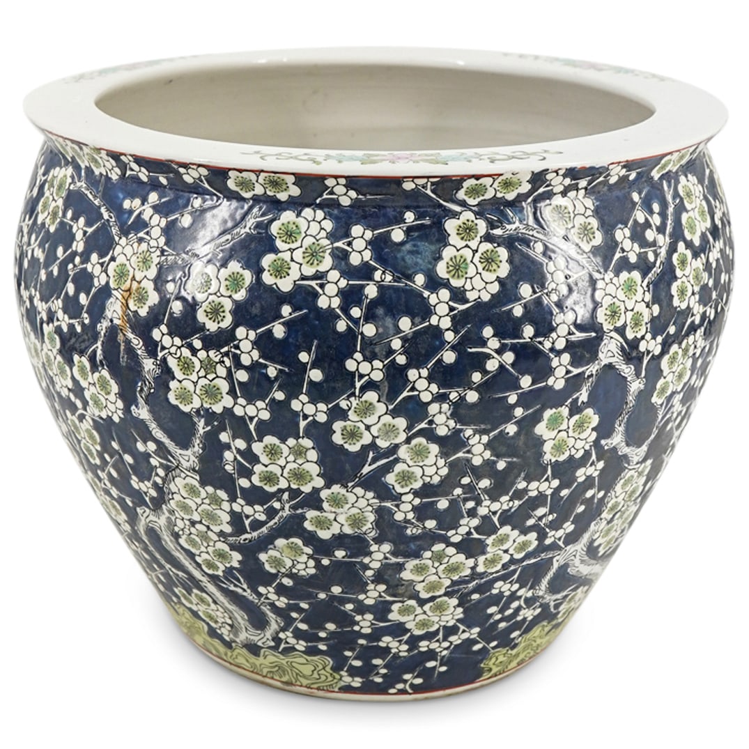 Antique Chinese Porcelain fish bowl Planter: DESCRIPTION: Antique Chinese porcelain fish bowl or planter with cherry blossom motifs at exterior, koi fish at interior and floral sprays to rim. CIRCA: Early 20th Cent. Possibly older. ORIGIN: China