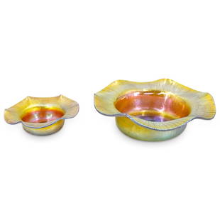 (2 Pc) Steuben Carder Era Gold Aurene Bonbon Dish & Salt Cellar: DESCRIPTION: Two Frederick Carder-era Steuben glass items, each featuring iridescent Gold Aurene coloration: (1) Bonbon dish. Marked with "Aurene 138" on underside. Dimensions: H: 2" Diameter: 5.75" (