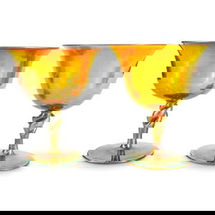 Pair Steuben Carder Era Gold Aurene Sherbets: DESCRIPTION: Pair of Frederick Carder-era Steuben iridescent gold Aurene glass sherbets, shape #2361, each featuring twisted stem with blue Aurene accents. One sherbet marked on underside with "Aurene
