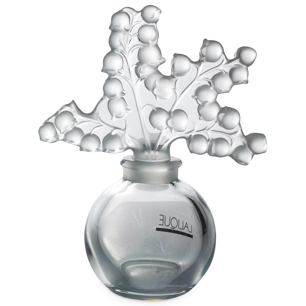 Lalique Crystal "Clairefontaine" Perfume Bottle: DESCRIPTION: Lalique frosted and clear crystal "Clairefontaine" perfume bottle or falcon featuring floral and foliage motifs. Marked with "Lalique France" on underside. "Lalique Paris" sticker adhered