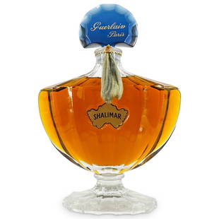 Large Display Guerlain Shalimar Factice Perfume Bottle: DESCRIPTION: A vintage large display Guerlain Shalimar factice dummy perfume bottle. CIRCA: 20th Cent. ORIGIN: France DIMENSIONS: H: 15" W: 10" CONDITION: Good Condition. (This is a display bottle. Do