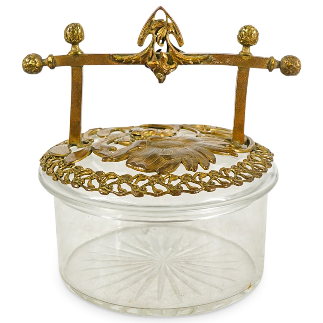 Lucien Marcel Bing (1875-1920) Art Nouveau Bronze And Crystal Box: DESCRIPTION: Art Nouveau box by Lucien Marcel Bing crafted from crystal and fitted with gilt bronze, floral and foliage form trimmings and handle. Finished with pineapple finials and open-work adornme