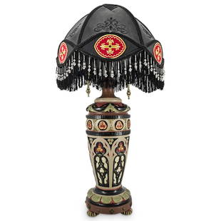 Vintage Gothic Revival Style Table Lamp: DESCRIPTION: Vintage table lamp crafted in the Gothic revival style from carved wood decorated with trefoils and stained glass window motifs and adorned with brass studs above the four feet. Lamp is f