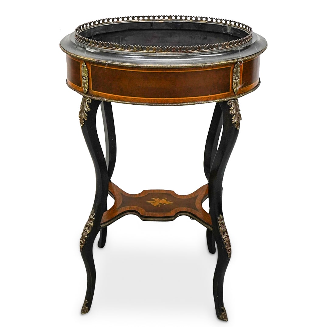 Antique Wooden Marquetry Jardiniere: DESCRIPTION: Antique wooden jardiniere featuring marquetry designs and gilt bronze adornments with floral and foliage motifs. CIRCA: Early 20th Century ORIGIN: European DIMENSIONS: H: 32.5" W: 15.25" 