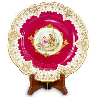 19th Century Sevres Porcelain Pastoral Courting Lovers Plate: DESCRIPTION: Antique Sevres porcelain plate fashioned for King Louis Philippe of France for the Chateau St. Cloud featuring a central image of two courting lovers with a dog by a tree. Finished with g