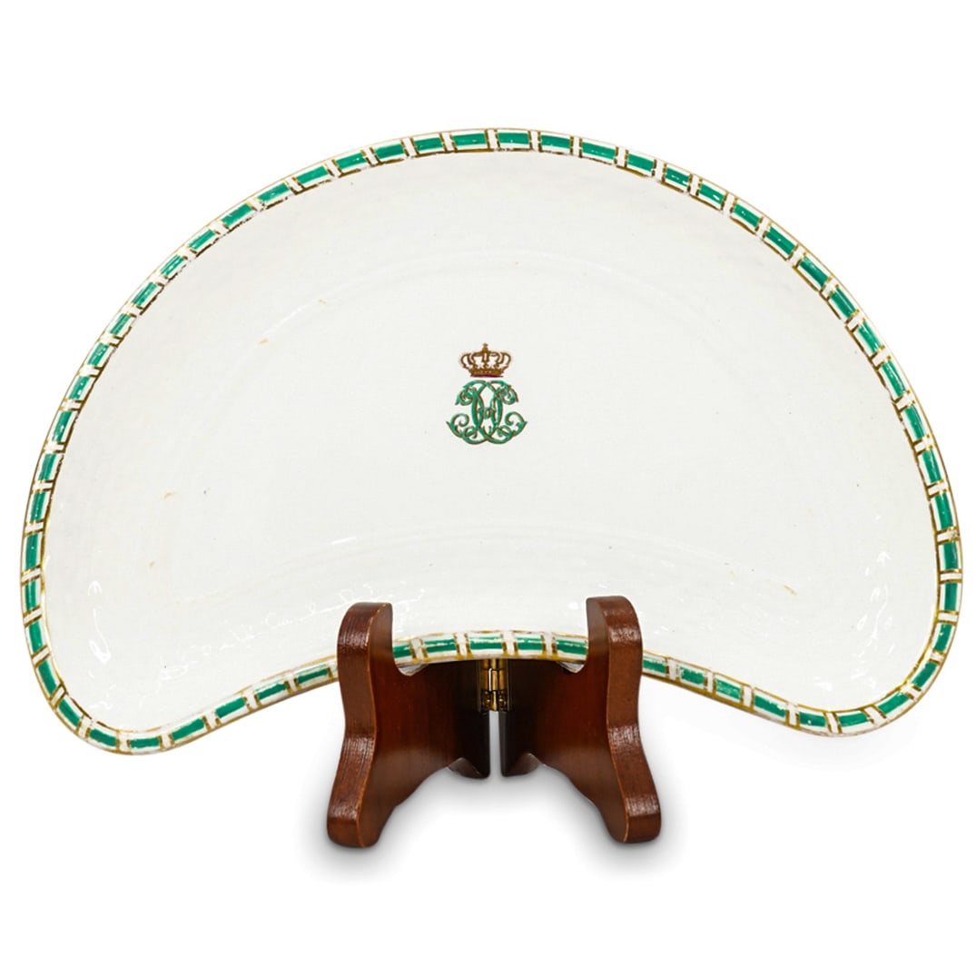 T. Goode & Co. Porcelain Salad Plate From Princess Beatrice's Table Service: DESCRIPTION: Porcelain crescent salad plate fashioned for Princess Beatrice, youngest daughter of Queen Victoria, featuring a textured lip, a guilt accented rim, and a crowned monogram in its well. Ha