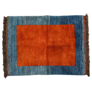 Antique Tibetan Tsuktruk Two Tone Wool Rug: DESCRIPTION: Antique Tsuktruk rug woven from wool in shades of blue and red and finished with brown tassels. CIRCA: 20th Century ORIGIN: Tibet DIMENSIONS: H: 0.75" W: 39" L: 54.25" CONDITION: Minor we