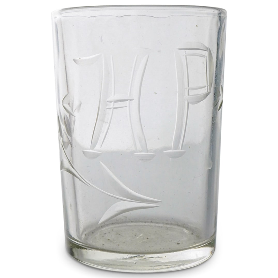Czar Nicholas II Romanov Shot Glass: DESCRIPTION: Shot glass belonging to Czar Nicholas II, marked with cut and frosted "NR" in Cyrillic script on side flanked by foliage. CIRCA: Early 20th Century ORIGIN: Russia DIMENSIONS: H: 2.5" D: 1