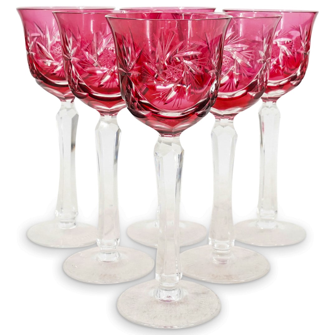(6 Pc) Antique Bohemian Cranberry Glass Stemware: DESCRIPTION: Six antique Bohemian wine glasses, each featuring a cut, cranberry glass bowl, a clear and faceted stem, and a flared lip. CIRCA: Early 20th Century ORIGIN: Czechoslovakia DIMENSIONS: H: 